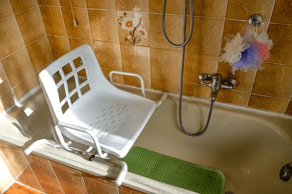 Senior woman using a Bathroom Safety for Seniors and grab bars for bathroom safety